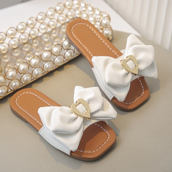 A Pair of Stylish White Sandals for Girls with a Playful Design, Featuring a Easy Look, Metal Buckle, Non-Slip Comfort, And Cuteness