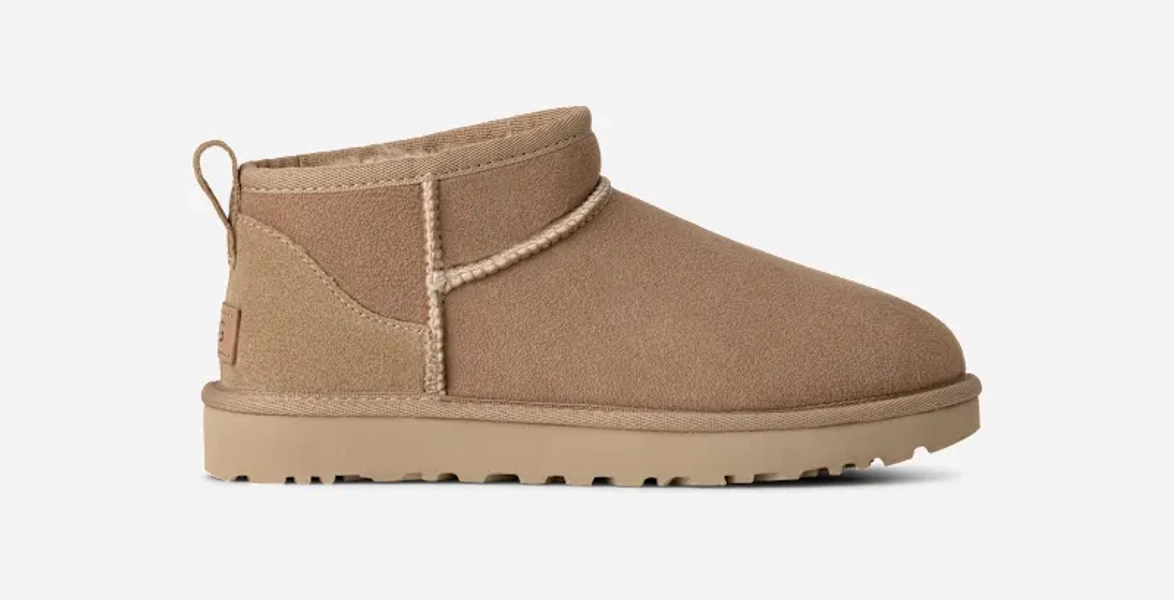 UGG® Women's Classic Ultra Mini Sheepskin Classic Boots in Sand, Size 8