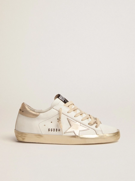 Women's Super-Star with gold sparkle foxing and metal stud lettering
