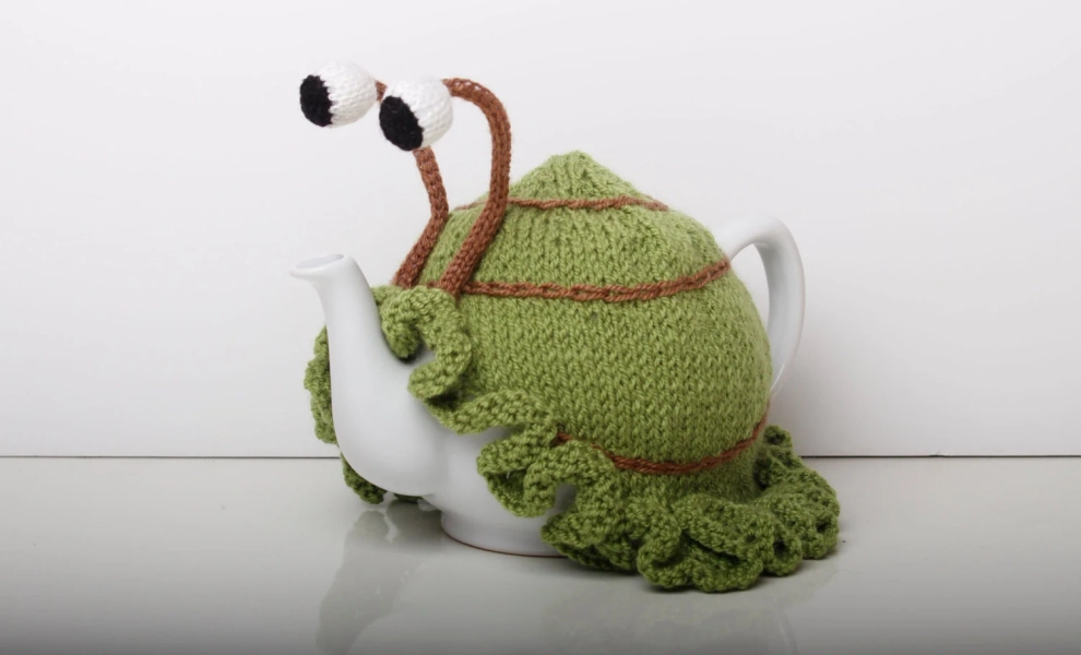 Garden lovers gift - snail tea cosy hand knitted with boggly eyes and frilly hem