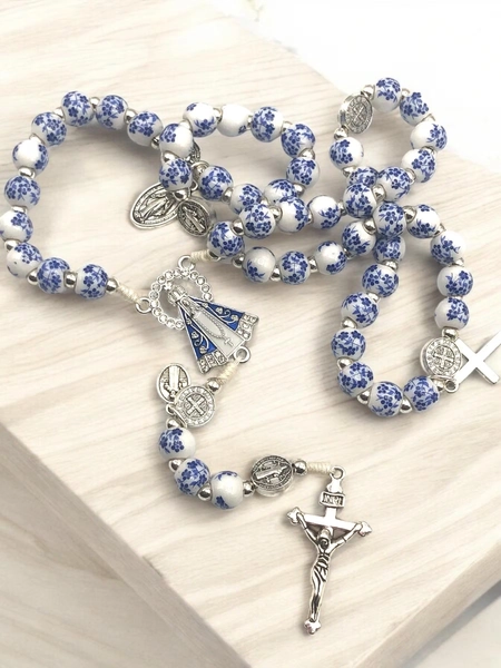 Rosary of blue flower beads with the Virgin of Guadalupe.