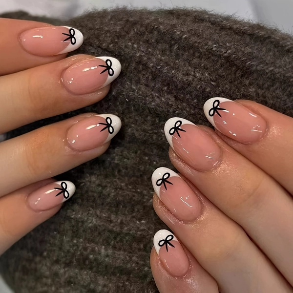 Upgrade Your Look with 24pcs Short Oval French-style Press-on Nails Featuring a Simple Bow Design for an Elegant and Sophisticated Look. These Removable False Nails Come with Jelly Glue, 1 Nail File, and 1 Applicator