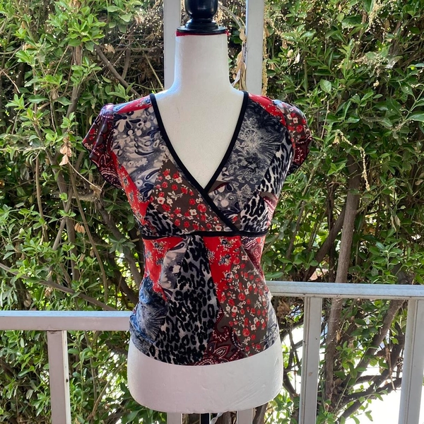 90s chic basement multi print top
has strings on the...