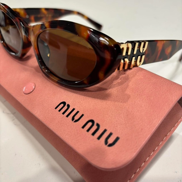 Miu Miu CatEye Sunglasses

Tortoise/Brown...