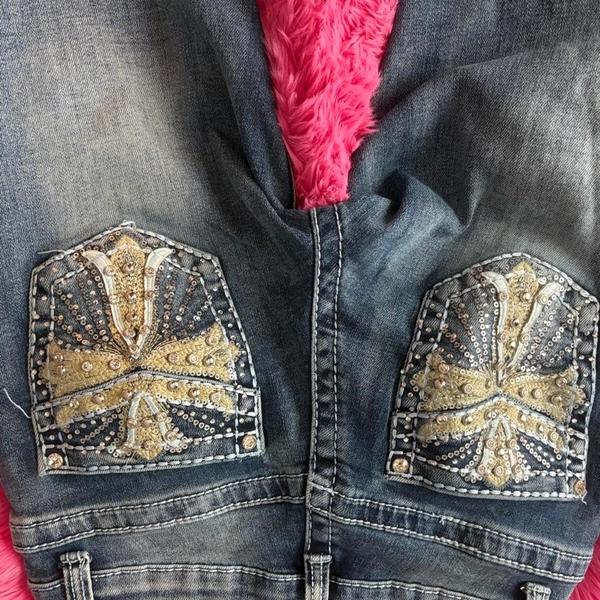 Low rise embellished jeans with rhinestones and...