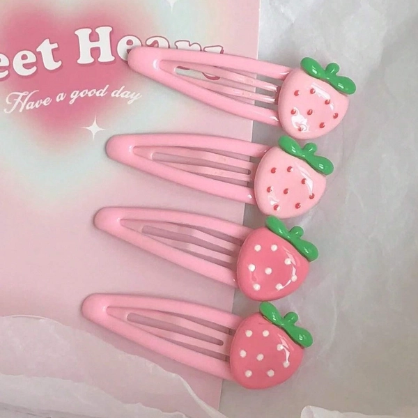 4pcs strawberry hair clip set, featuring cute and sweet-style plastic clips with vibrant anime-inspired oval shapes, perfect for daily use to gently secure bangs and side strands