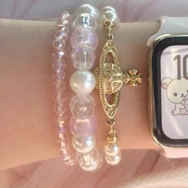 Vivienne Westwood Mini Bas Relief pearl bracelet featuring gold-tone hardware and the brand's iconic orb logo