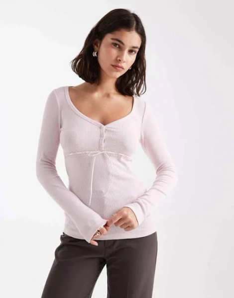 Shop Hollister long sleeve v neck button detail top in pink on Sale at BeyondStyle – Get Lowest price in three month Hollister long sleeve v neck