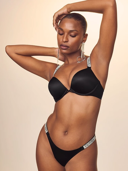 Le soutien-gorge pigeonnant qui ajoute 2 tailles de bonnet à bretelles scintillantes à logo Bombshell