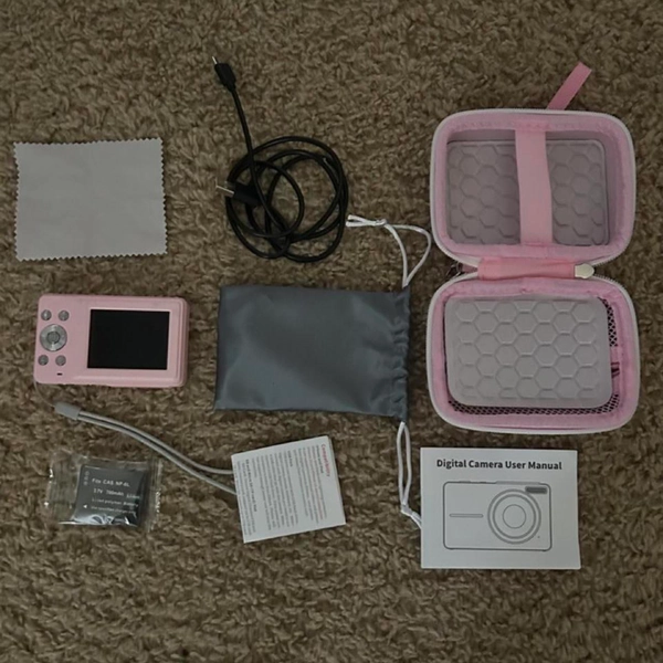Pink Fujifilm digital camera with all accessories...