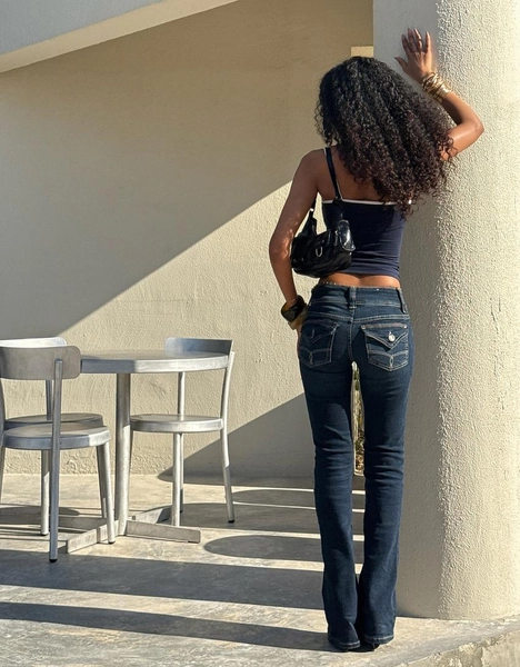 Low-rise boot-cut jeans with flaps