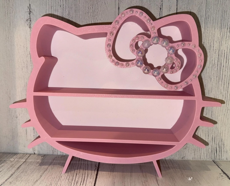 Hello Kitty Shelf: Pink Kawaii Display with Pearl Bow.