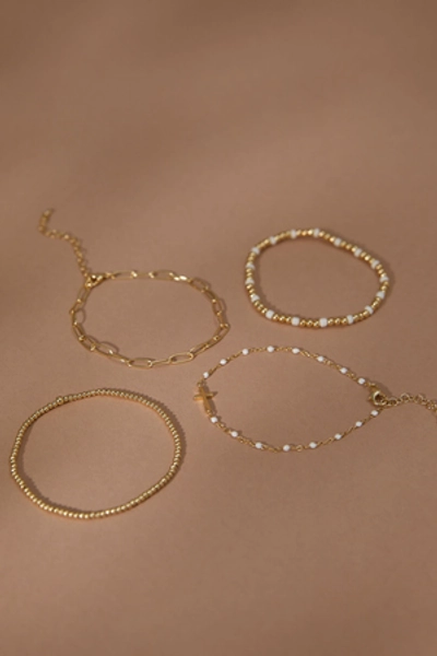 
        Pearl Cross Bracelet Set in Gold & WHite | Altar'd State
    