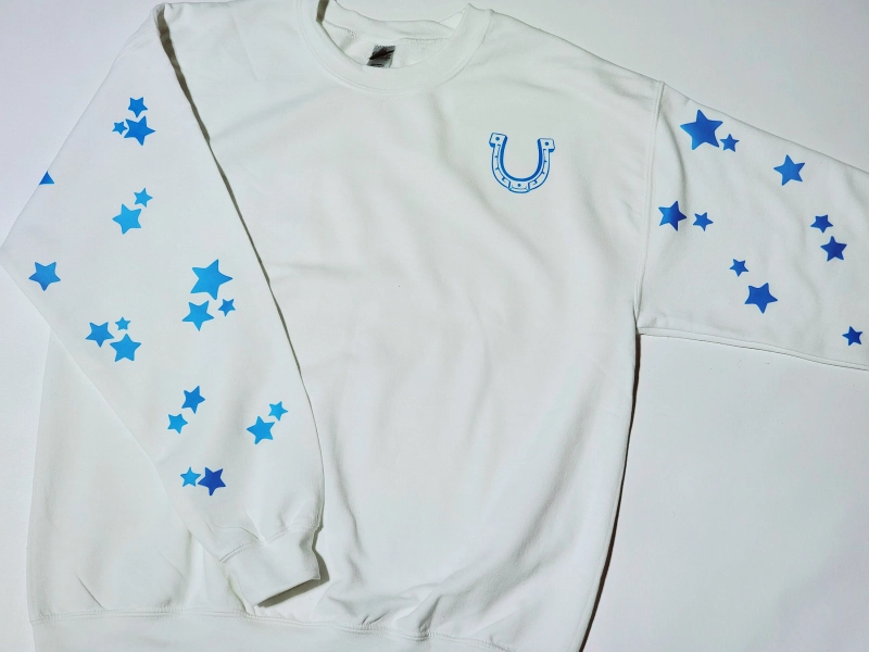 Star Cowboy sweatshirt with blue glow in the dark stars and horseshoe. White glow in the dark star back shoulder Sizes Small - 3X