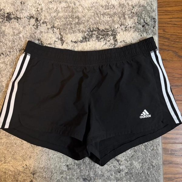 Adidas black shorts with white stripes #athletic...