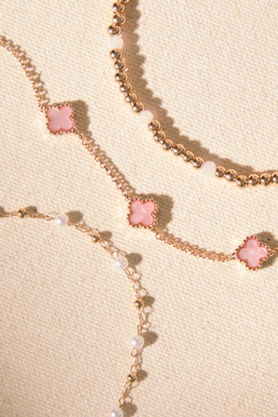 
        Dainty Clover Pearl Bracelet Set in Gold & Pink | Altar'd State
    