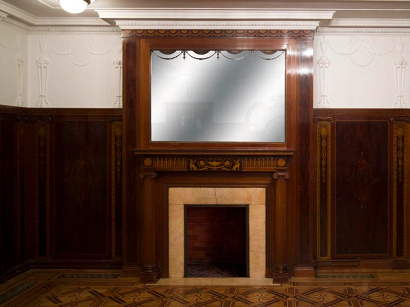 Exceptional antique Regency style complete paneled room in mahogany marquetry with fireplace, France 19th century