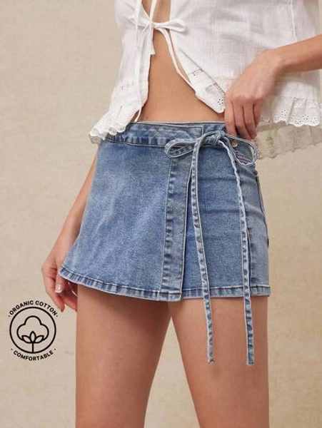 WESTFADE Mid Rise Foldover Tie Side Waist Eyelet Bow Applique Back Pocket Wrap Front Denim Mini Skort