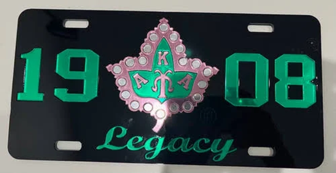 1908 w/ AKA Symbol Legacy Tag- Blk Bckgrnd Green Ltrs & Numbers Pink Ivy