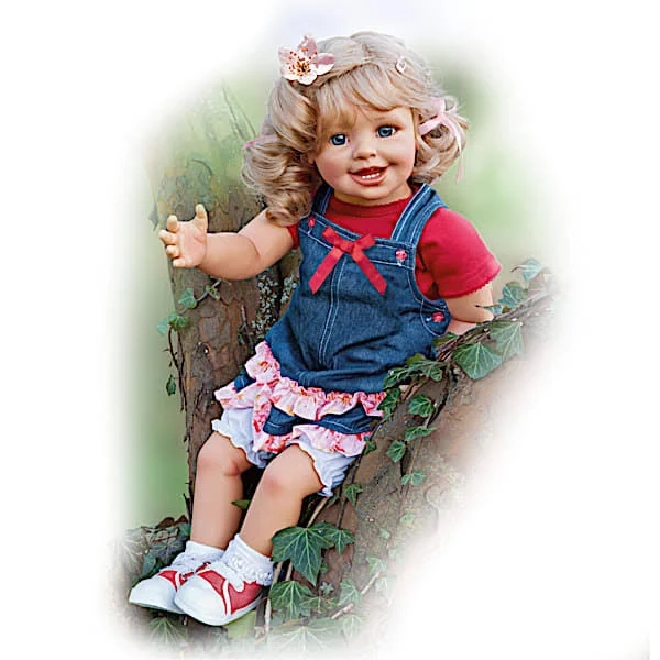 Vinyl Lifelike Child Doll with Cloth Body