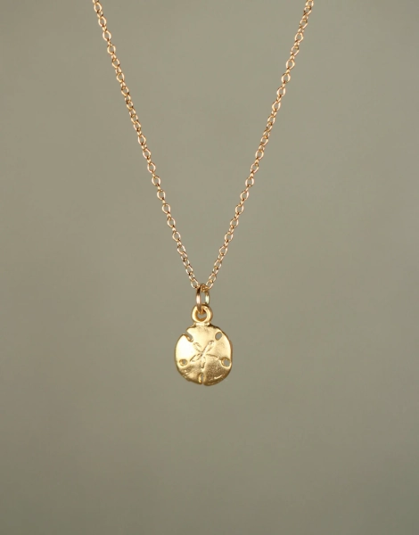 Gold sand dollar necklace - delicate necklace - a tiny 14k gold vermeil sand dollar hanging from a 14k gold filled chain