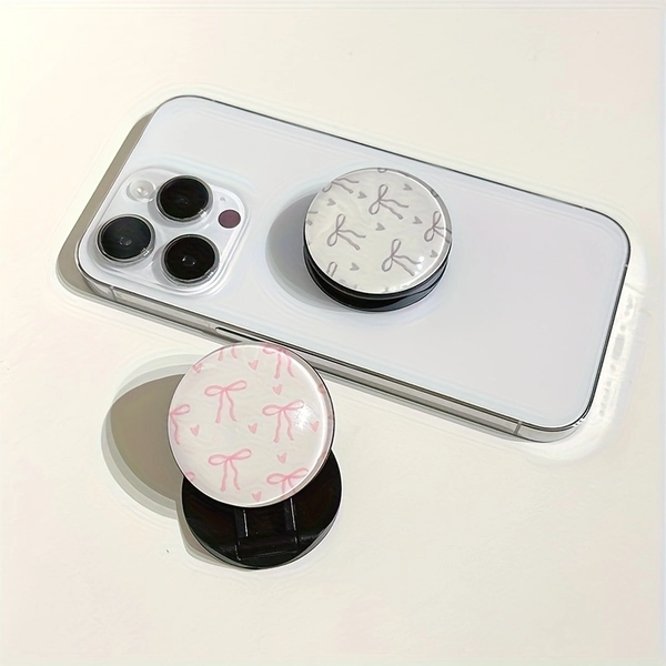 A Round, Three-Dimensional Mobile Phone Stand with a Bow Tie Design, Featuring a Push-Pull Mechanism And a Telescopic Folding Feature