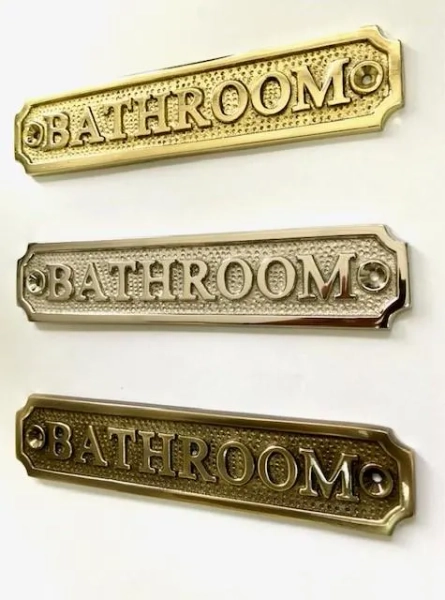 Bathroom door sign available in three finishes - nickel, antique bronze or brass. Matching screws are included. 16.2 cm X 3.3 cm.