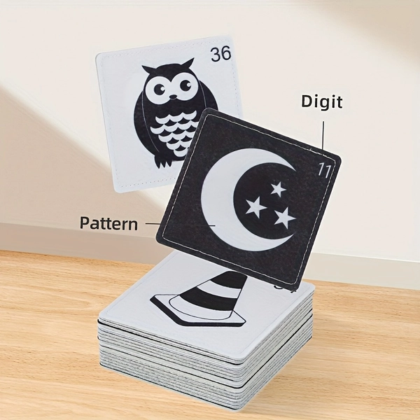 Tarjetas de tela y color negro para la educación temprana de bebés, con varios temas como animales y objetos. Diseño de doble cara con patrones de alto contraste, material lavable y duradero.