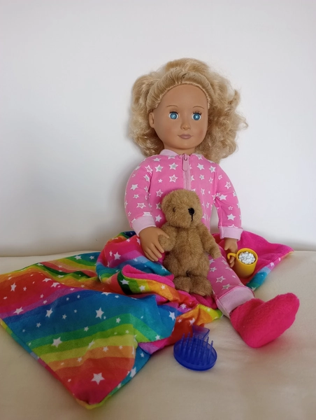 Our Generation Doll with blonde hair, blue eyes and ready for her sleepover.