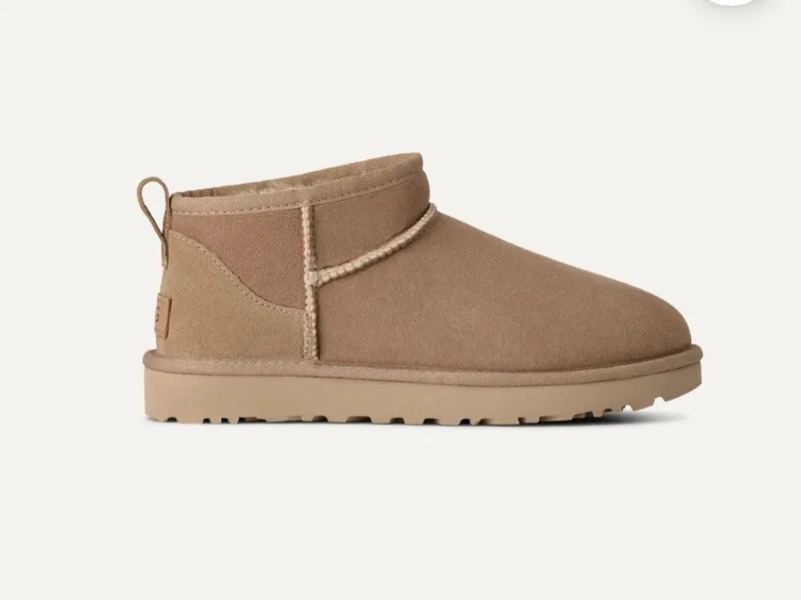 UGG® Women's Classic Ultra Mini Sheepskin Classic Boots in Sand, Size 9