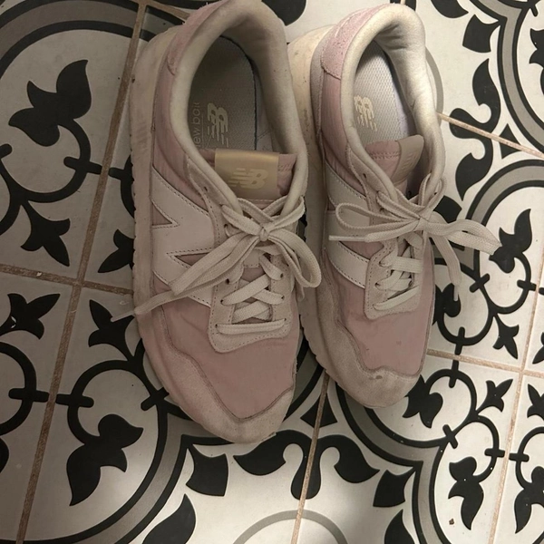 Pink and white New Balance trainers