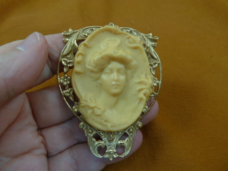 Woman Gibson Girl style hair in bun flowers bow trim ivory colored Cameo brass pin pendant brooch CL66-13