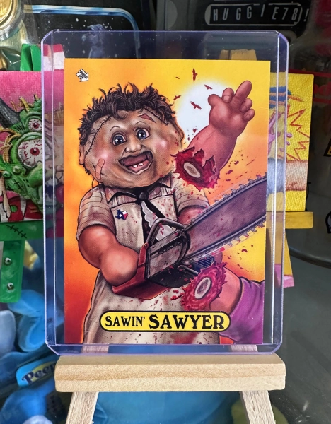 Sawin' SAWYER  - Texas Chainsaw themed Garbage Pail Kids parody card by Michael Barnard