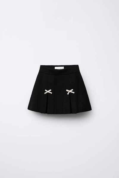 KNIT SKIRT WITH BOWS
