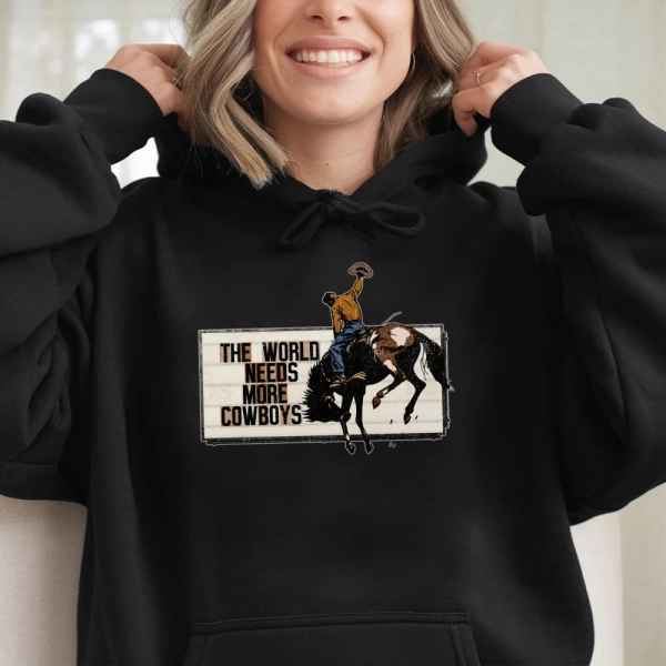 The World Needs More Cowboys Hoodie | Vintage Rodeo Graphic Western Sweatshirt | Premium Cotton Blend | Gift for Country Music Lovers & Ranchers