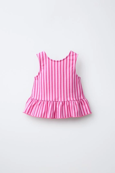 STRIPED PEPLUM T-SHIRT WITH CONTRASTING PIQUET