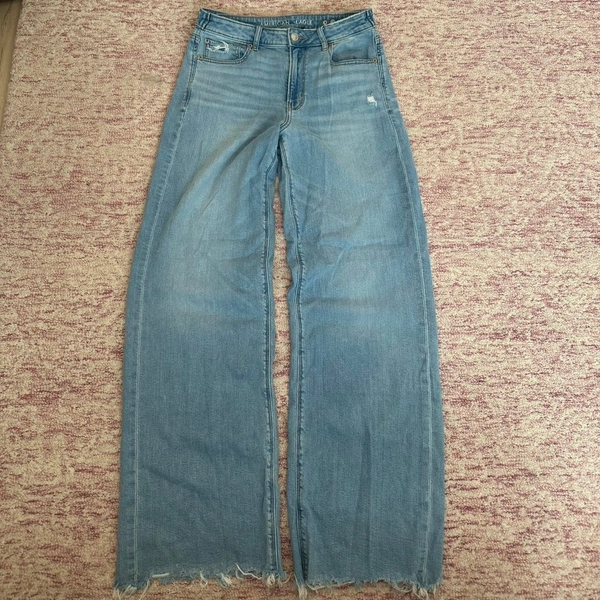 wide leg light wash American Eagle jeans with cut...