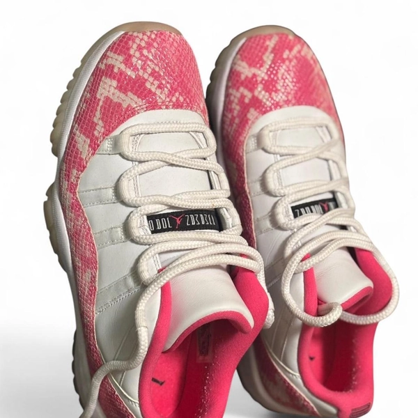 White and pink Air Jordan 11 Retro Low SE trainers...
