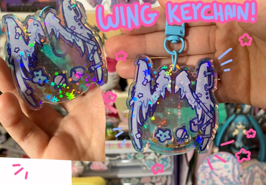 Glitter rainbow, wing shaker keychains , with 3 mini charms.