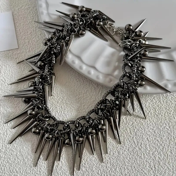 The Black Studded Necklace Features a Unique Combination of Chains And Studs. The Clasp And Adjustable Links Are Intricately Designed, Making It Perfect for Wearing at Music Festivals And Similar Events